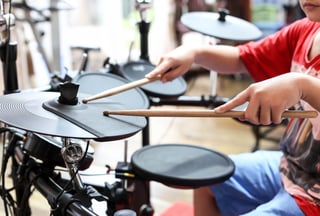 Kid playing drums