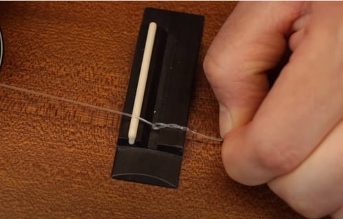 tie the ukulele strings