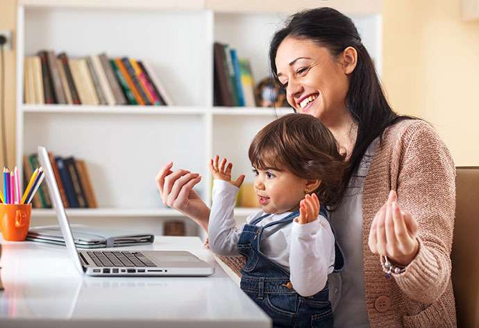 happy-mother-with-her-child-using-laptop