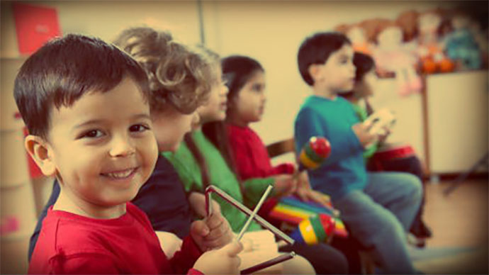 smiling-kid-while-playing-instrument